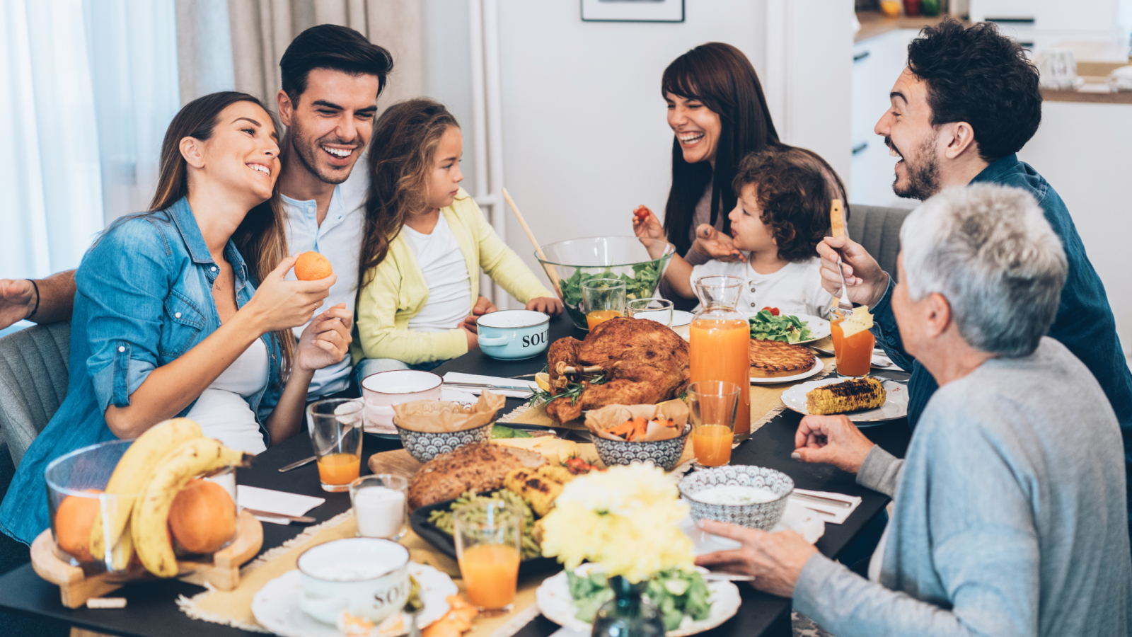 Family gathered around table for holiday meal